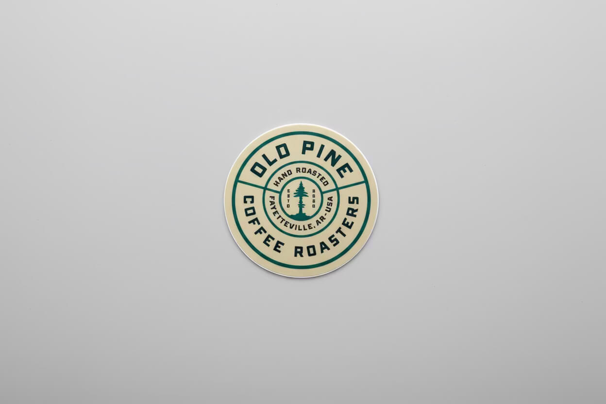 Cream Old Pine branded badge sticker, circular design with signature logo 