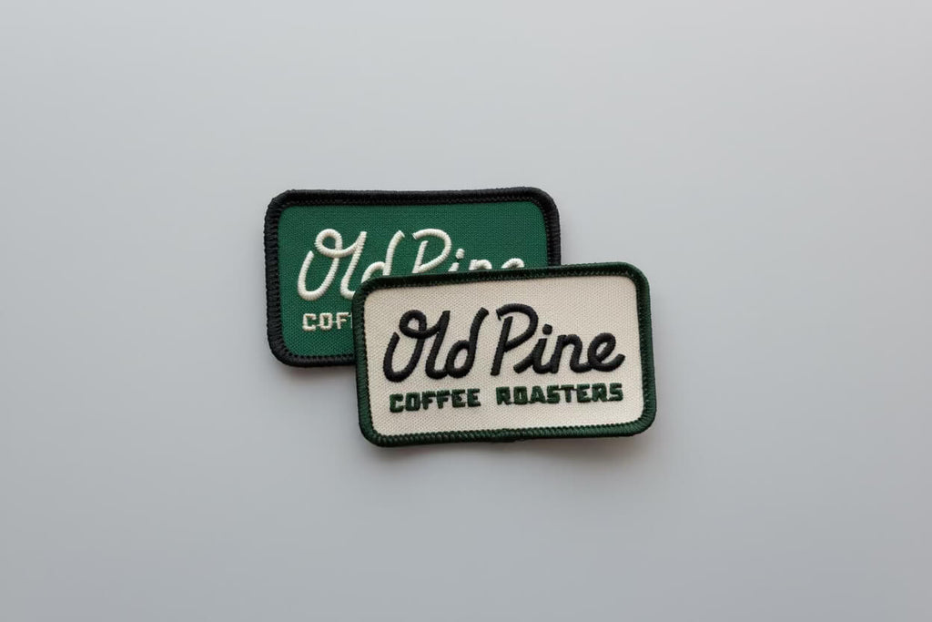 Two rectangular patches with 'Old Pine Coffee Roasters' branding on a light gray background.