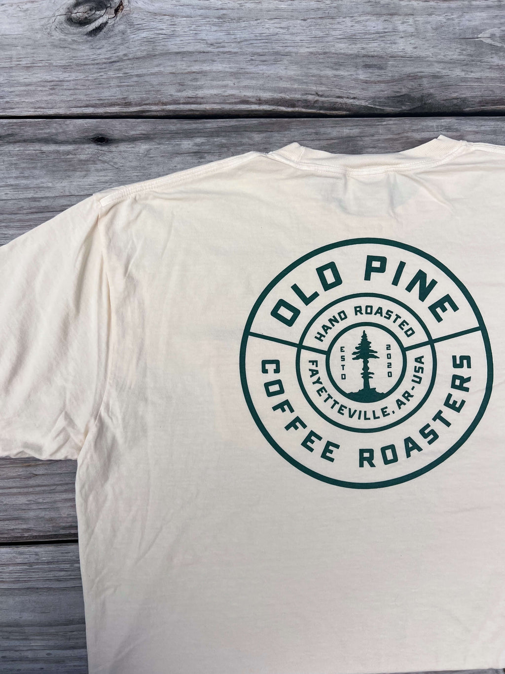 Cream t-shirt with Old Pine Coffee Roasters badge logo on back of shirt