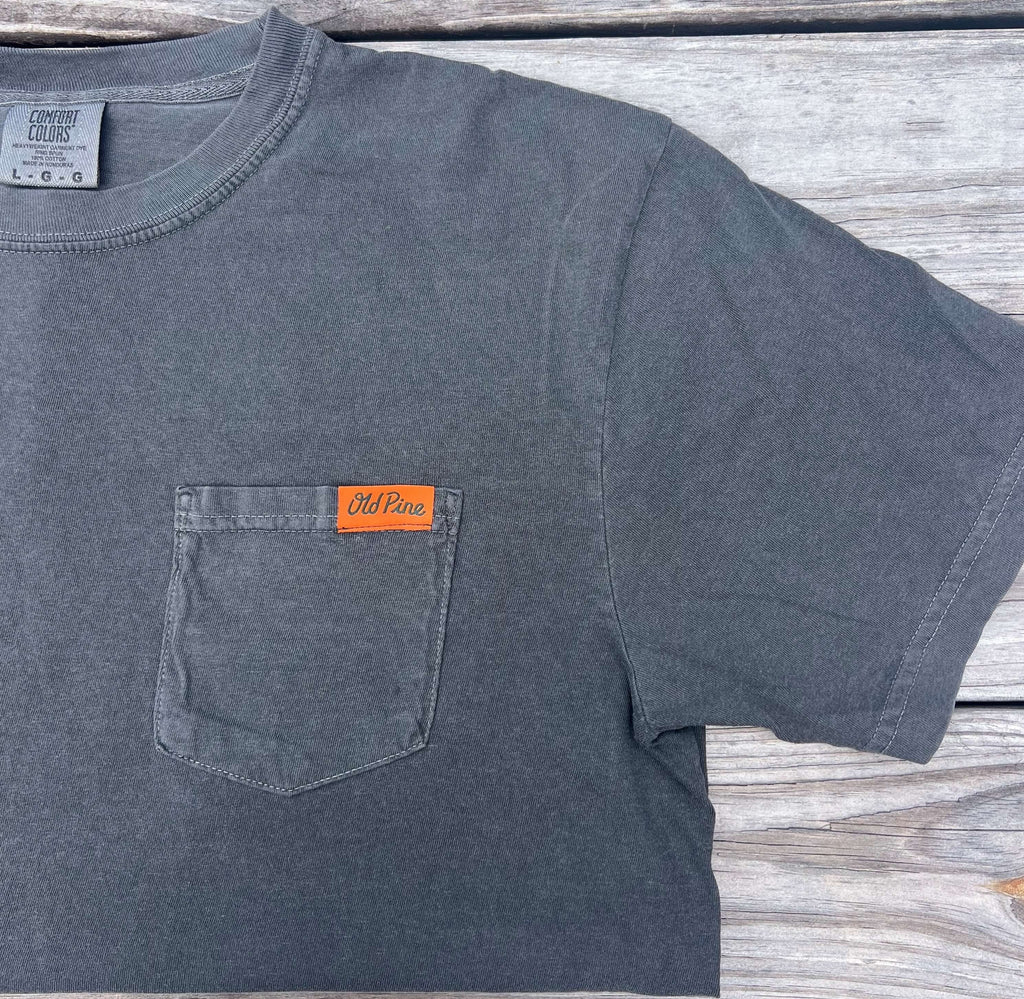 Gray t-shirt with a front pocket that has orange "old pine" label 