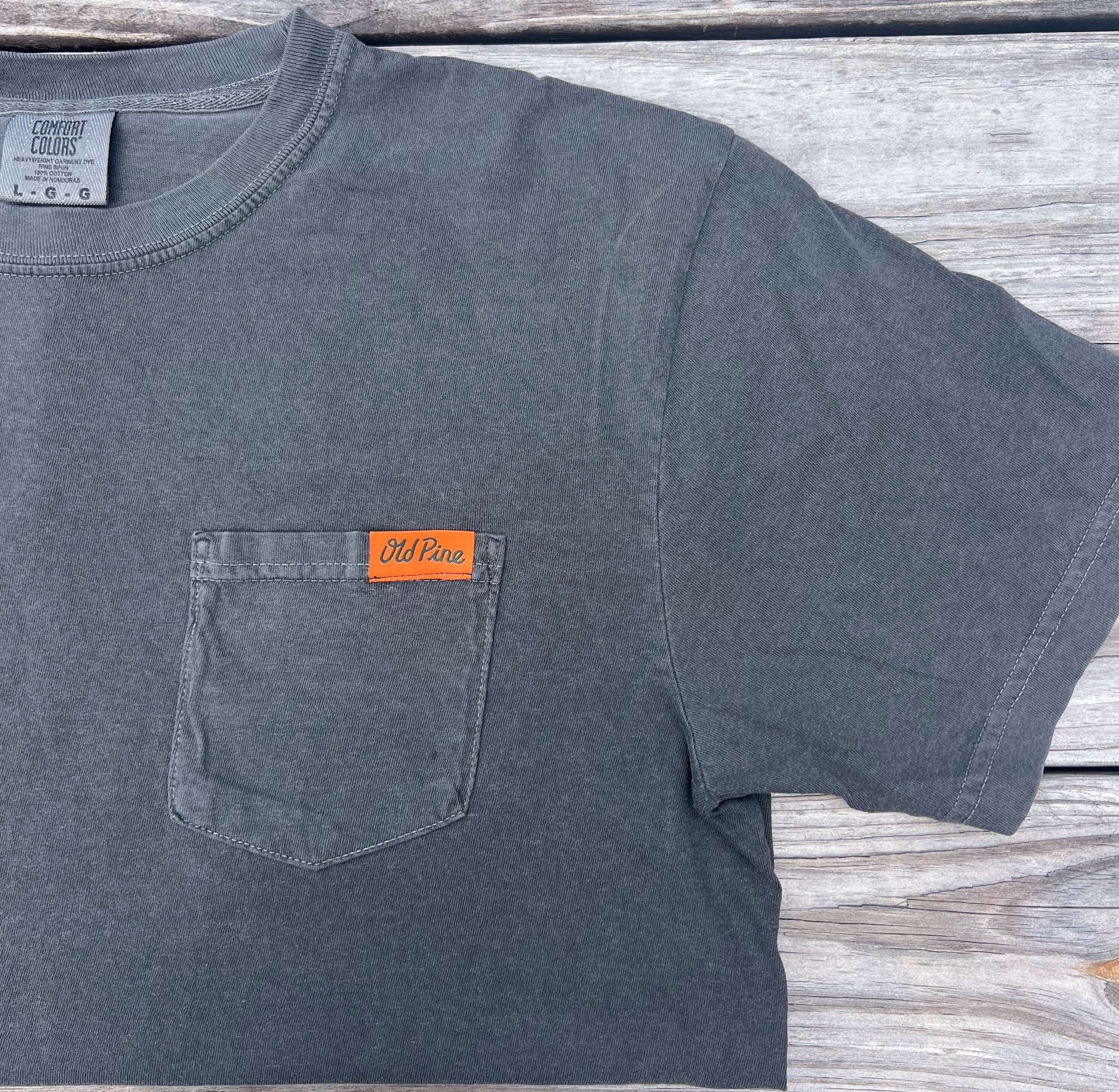 Gray t-shirt with a front pocket that has orange "old pine" label 