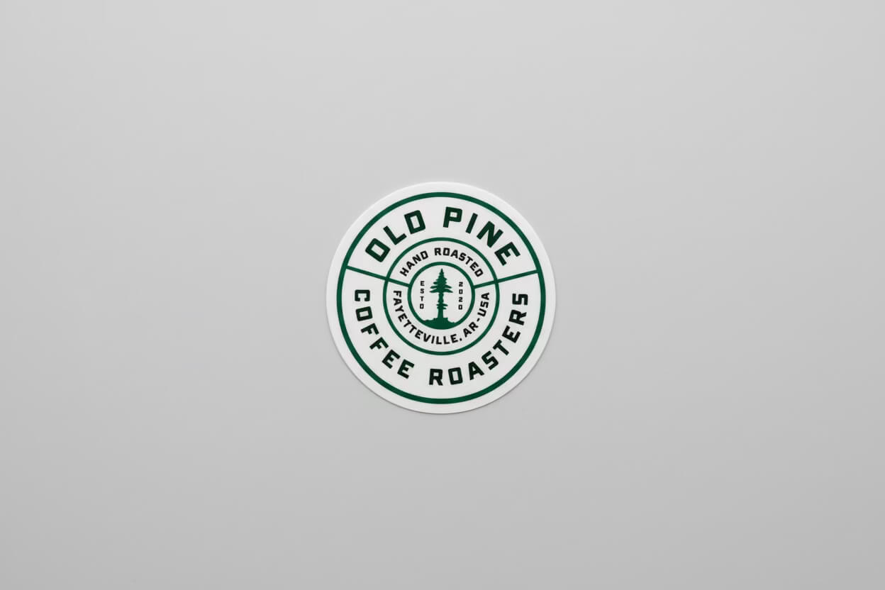 White Old Pine branded badge sticker, circular design with signature logo 